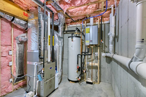 Residential furnace and boiler heating system in a basement utility room
