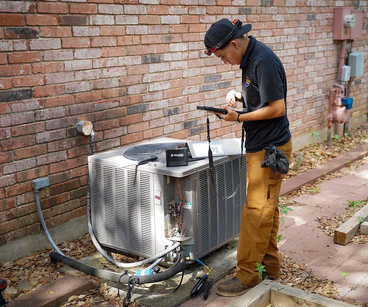 HVAC technicians installing a new high-efficiency system