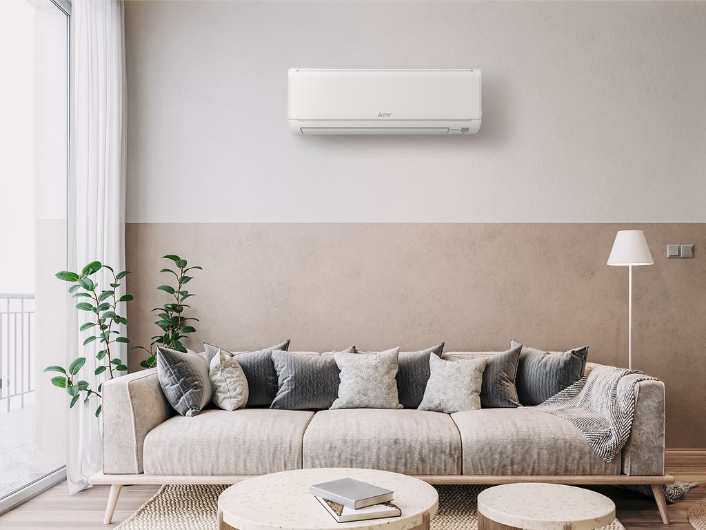 Ductless mini-split air conditioning unit mounted on an interior wall